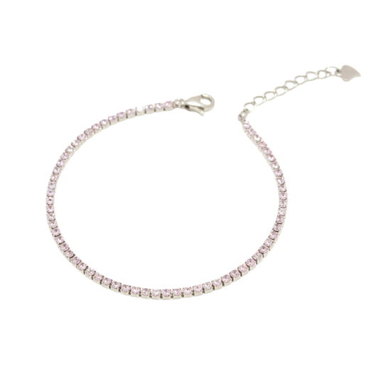 Silver bracelet with pink stones on a white background