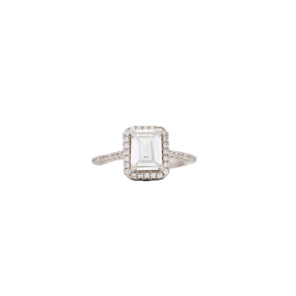 Elegant silver emerald cut ring with halo and pavé setting, perfect for women’s jewelry collection