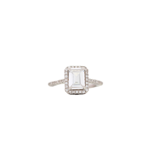 Elegant silver emerald cut ring with halo and pavé setting, perfect for women’s jewelry collection
