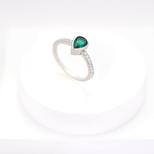 side view of Elegant silver ring with teardrop emerald center stone and side diamonds – Ihraya 