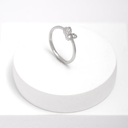 Silver swan ring on a white stand